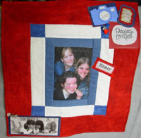 small wall hanging quilt with pictures and other memory items attached
